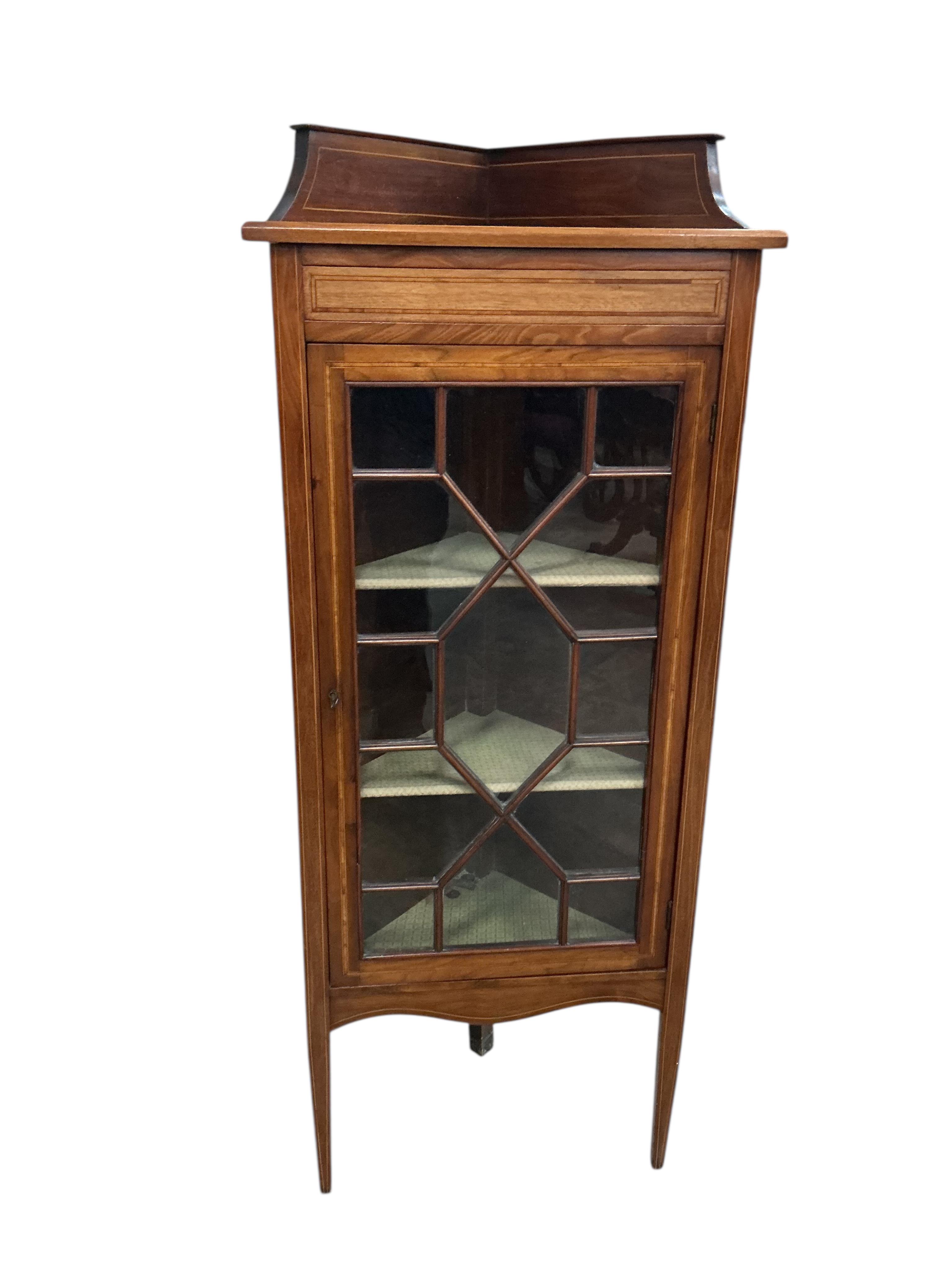 A pair of Edwardian mahogany standing corner cabinets, width 54cm, depth 33cm, height 132cm